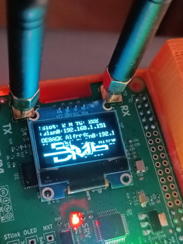 Close-up of the small screen showing garbled text
