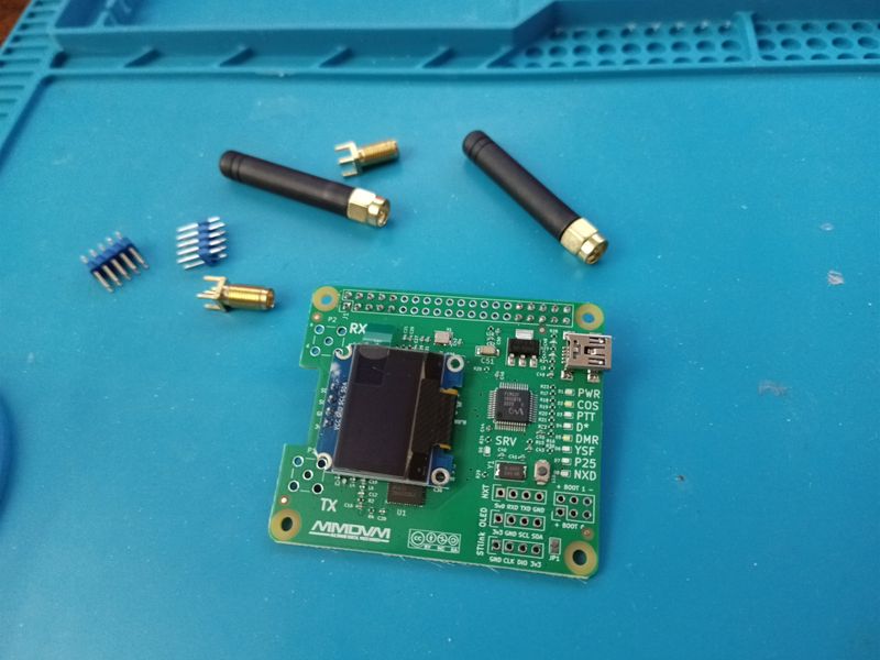 The bare radio board with its antennas, connectors and header pins before assembly