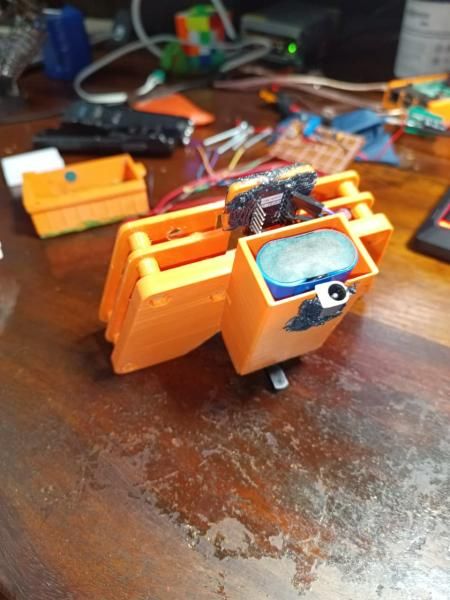 The remote from the side and back, showing the battery compartment and the board mounted on top