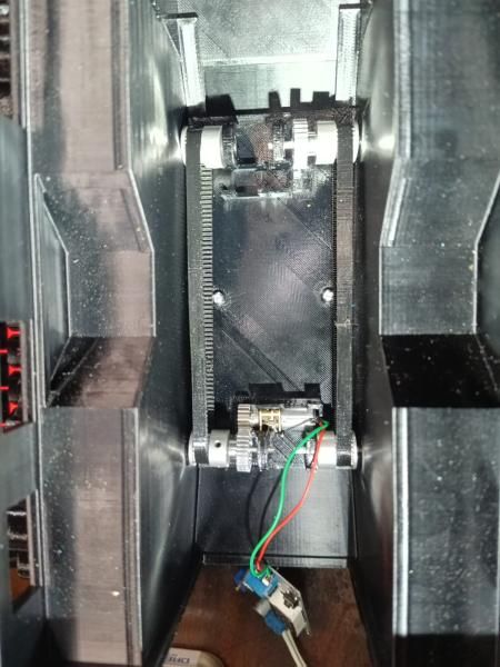 Inside the body, the motor and the belt running between the axles