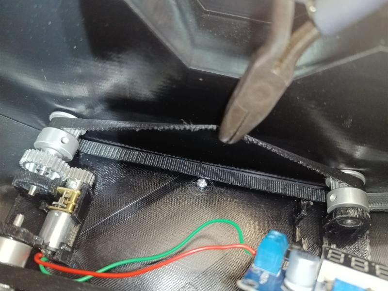 Close-up of the belt, pulleys and motor inside the body