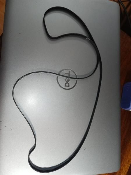 The long black rubber GT2 belt laid out in a loop